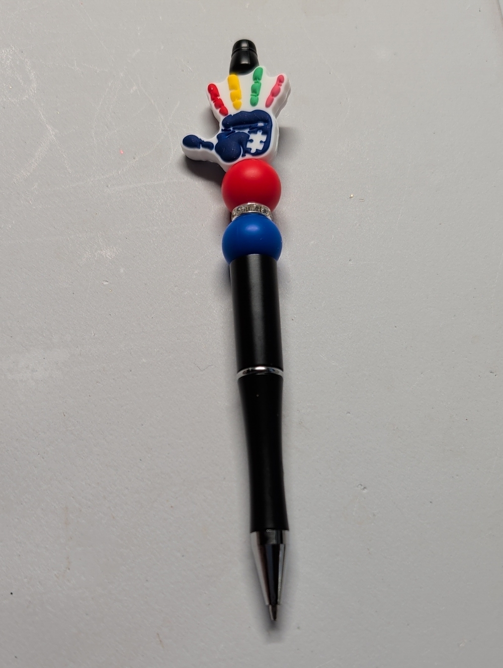 Hand Crafted Black Pen with Red, Blue and Multicolor Hand Charm
